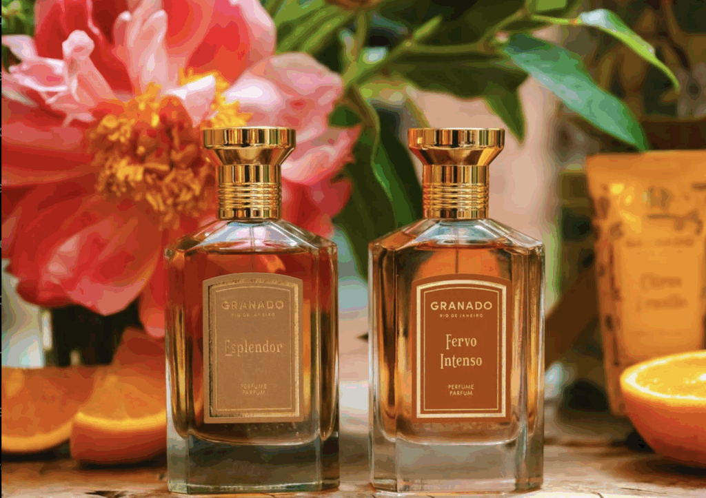 INDIEHOUSE tropical fragrance display featuring bright citrus, coconut, and beach-inspired perfumes arranged in a sunlit setting